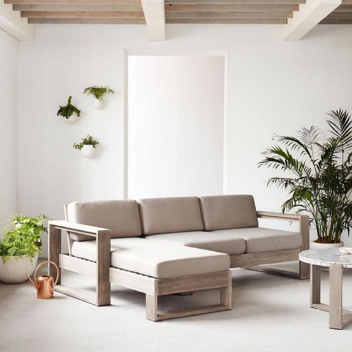 Sofa gỗ chữ L đệm vải được thiết kế đơn giản, không sử dụng những chi tiết trang trí rườm rà