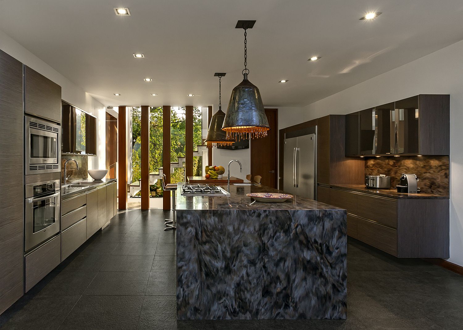 Unique-pendants-with-metallic-glint-and-custom-kitchen-island-in-stone