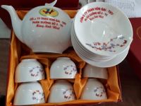 Ấm chén bưởi cành hoa đào inlogo