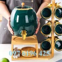 Bộ bình trà sứ xương men xanh vẽ vàng có giá gỗ