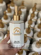 Bình xịt đựng dầu gội, sữa tắm bằng sứ hình bát giác in logo memorina