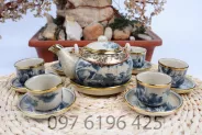 Bộ ấm chén men rạn bọc đồng dáng Nhật quai đồng vẽ sơn thủy