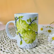 Cốc sứ trắng quai C vẽ hoa