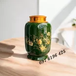 Hũ đựng trà màu xanh lá hoa mai vàng