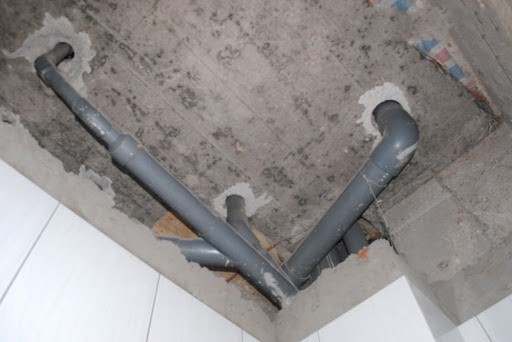 A picture containing indoor, dirty, building, sittingDescription automatically generated